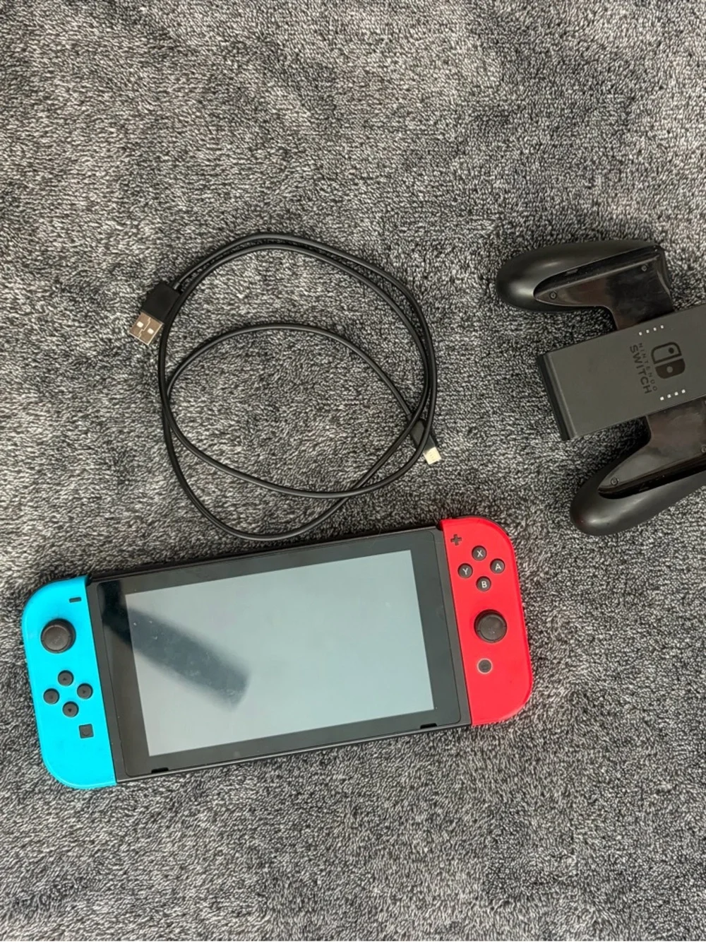 Nintendo Switch with Red & Blue Joy-Con Controllers + hand held controller